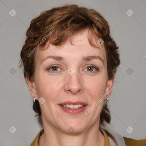 Joyful white adult female with medium  brown hair and blue eyes