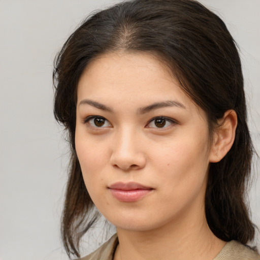 Neutral asian young-adult female with medium  brown hair and brown eyes