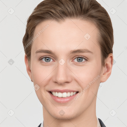 Joyful white young-adult female with short  brown hair and grey eyes