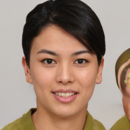 Joyful asian young-adult female with short  brown hair and brown eyes