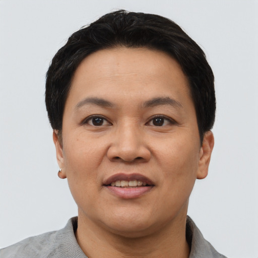 Joyful asian adult female with short  black hair and brown eyes