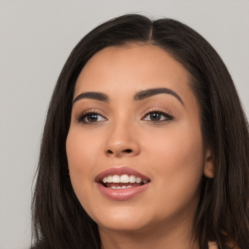 Joyful white young-adult female with long  black hair and brown eyes