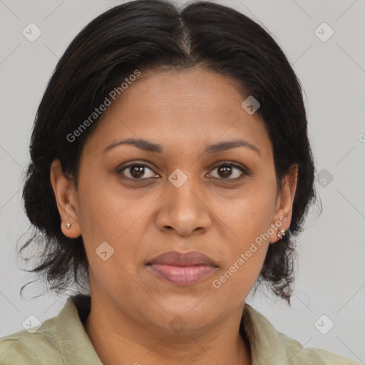 Joyful black adult female with medium  brown hair and brown eyes