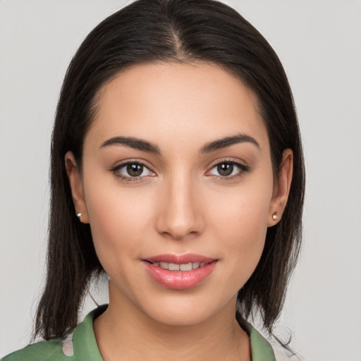 Joyful white young-adult female with medium  brown hair and brown eyes