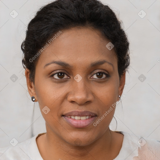 Joyful black young-adult female with short  brown hair and brown eyes