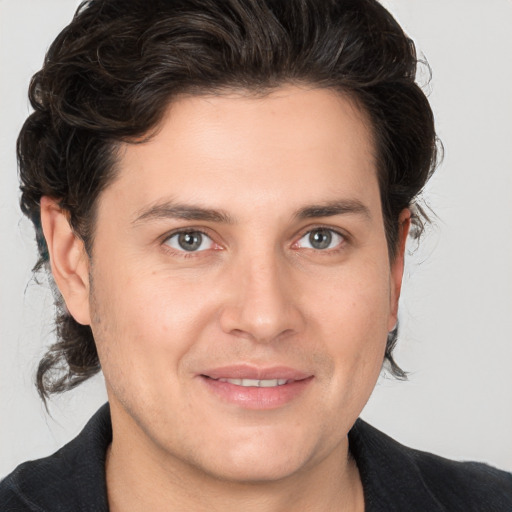 Joyful white young-adult male with medium  brown hair and brown eyes