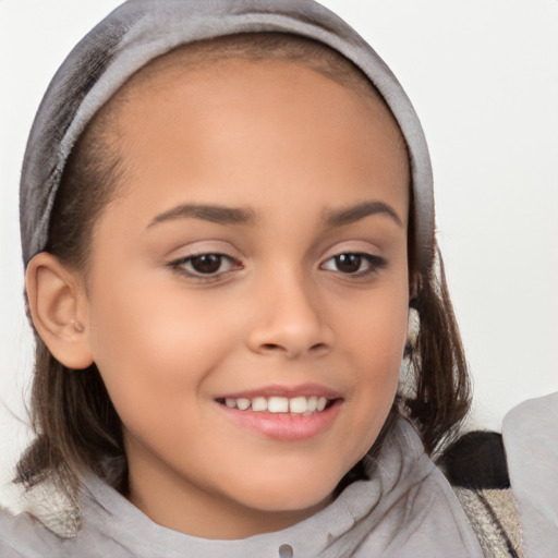 Joyful white child female with long  brown hair and brown eyes