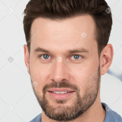 Joyful white young-adult male with short  brown hair and brown eyes