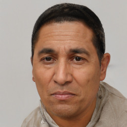 Neutral latino adult male with short  brown hair and brown eyes