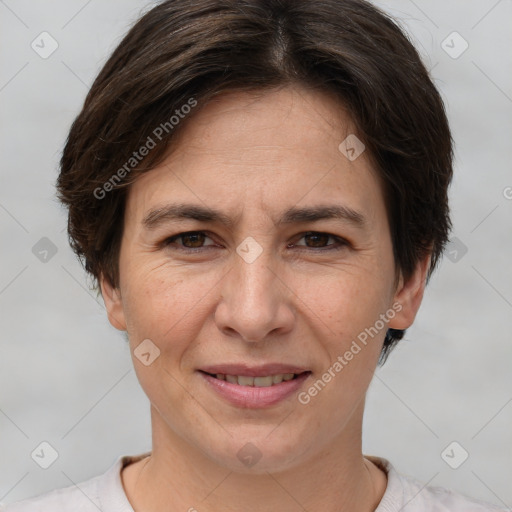 Joyful white adult female with short  brown hair and brown eyes