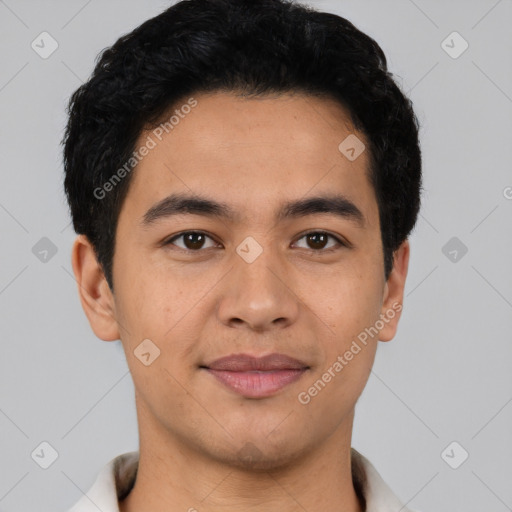 Joyful latino young-adult male with short  black hair and brown eyes