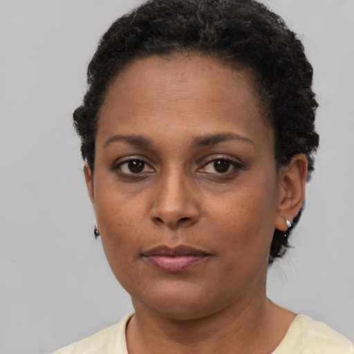 Neutral black young-adult female with short  brown hair and brown eyes