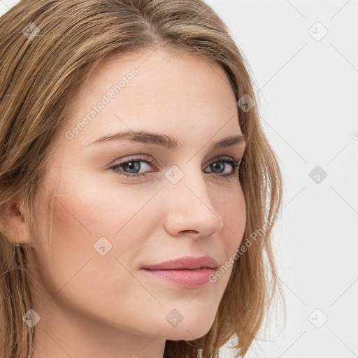 Joyful white young-adult female with long  brown hair and blue eyes