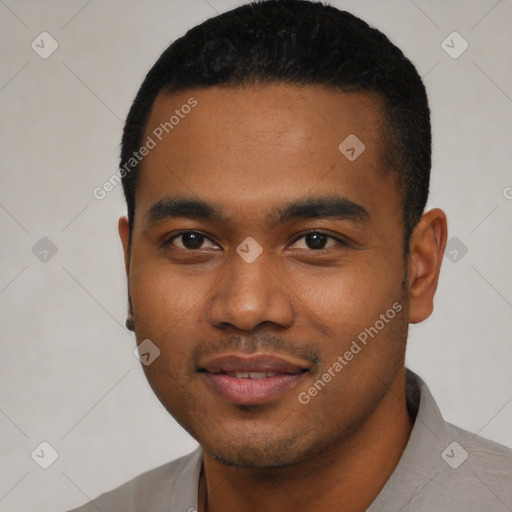 Joyful black young-adult male with short  black hair and brown eyes