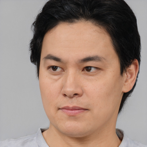 Neutral asian young-adult male with short  brown hair and brown eyes