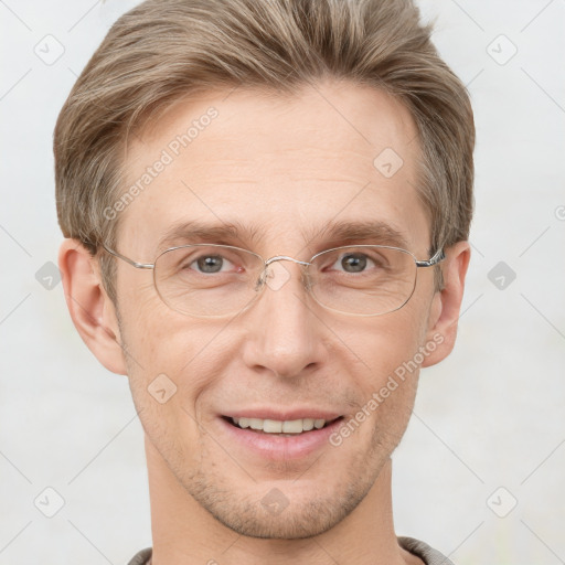 Joyful white adult male with short  brown hair and grey eyes