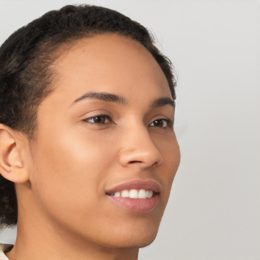 Joyful latino young-adult female with short  brown hair and brown eyes