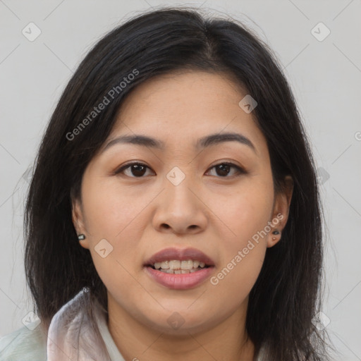 Joyful asian young-adult female with long  brown hair and brown eyes