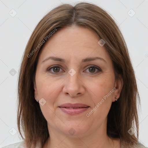 Joyful white adult female with medium  brown hair and brown eyes