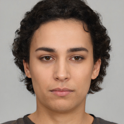 Neutral white young-adult female with short  brown hair and brown eyes