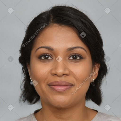 Joyful black adult female with medium  brown hair and brown eyes