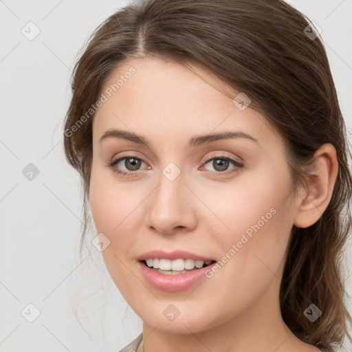 Joyful white young-adult female with medium  brown hair and grey eyes