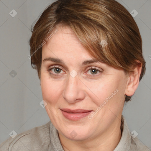 Joyful white adult female with medium  brown hair and grey eyes