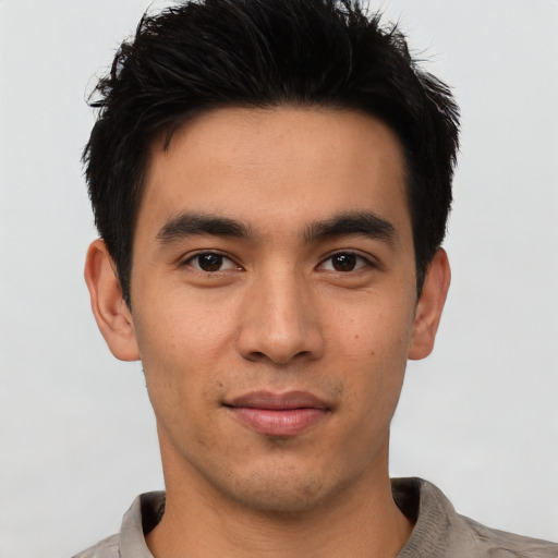 Joyful asian young-adult male with short  black hair and brown eyes