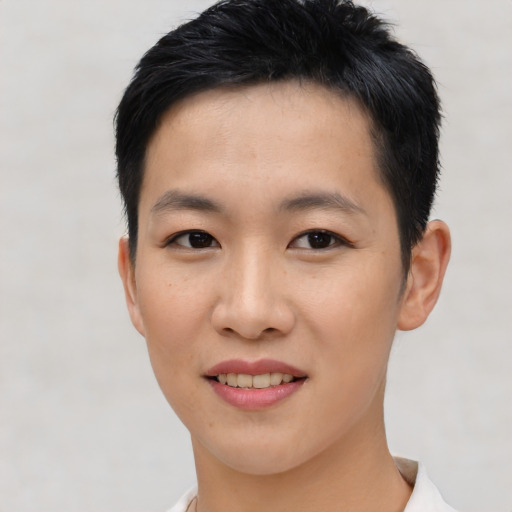 Joyful asian young-adult female with short  black hair and brown eyes