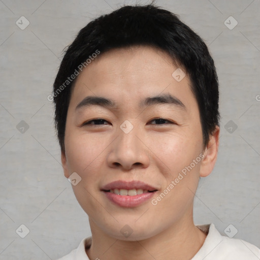 Joyful asian young-adult male with short  black hair and brown eyes