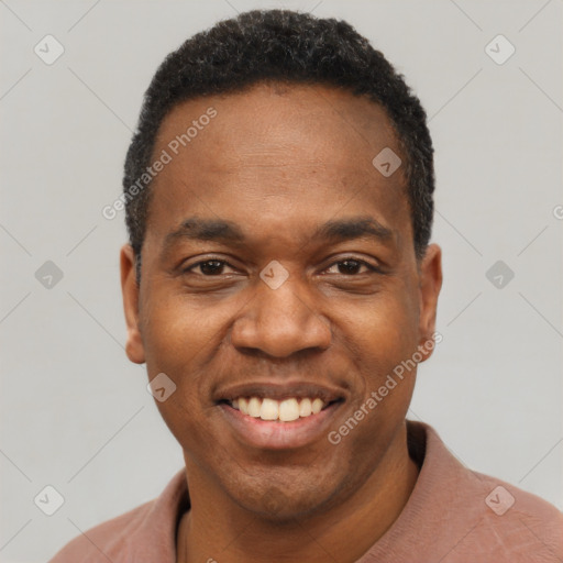 Joyful black young-adult male with short  black hair and brown eyes