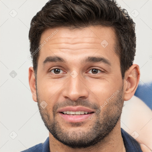 Joyful white young-adult male with short  brown hair and brown eyes