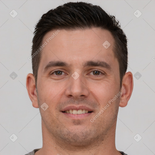 Joyful white young-adult male with short  brown hair and brown eyes