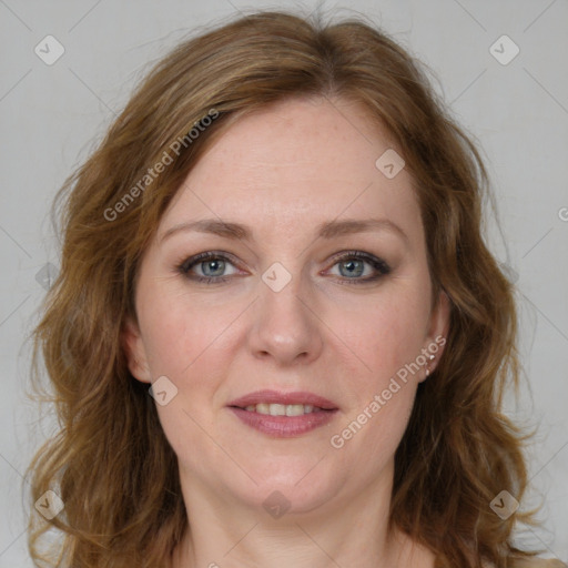 Joyful white adult female with medium  brown hair and blue eyes