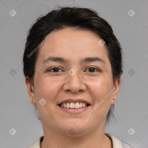 Joyful white adult female with short  brown hair and brown eyes