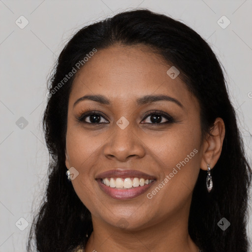 Joyful latino young-adult female with long  brown hair and brown eyes