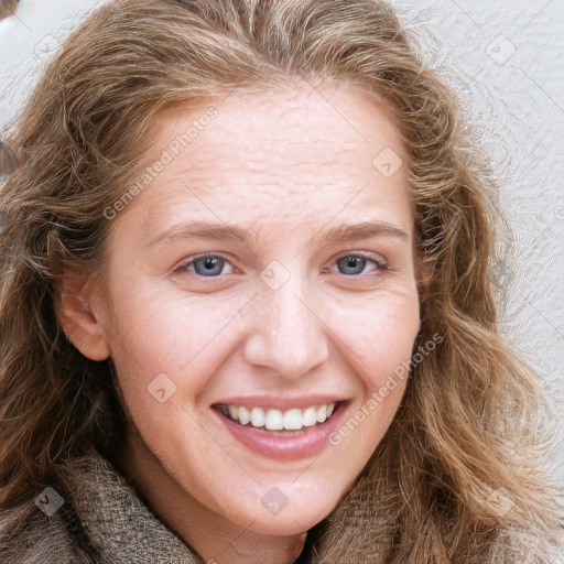 Joyful white young-adult female with long  brown hair and blue eyes