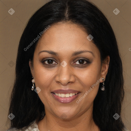 Joyful black young-adult female with long  brown hair and brown eyes