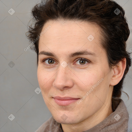 Joyful white adult female with medium  brown hair and brown eyes