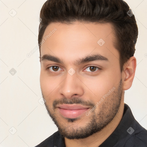 Joyful white young-adult male with short  brown hair and brown eyes