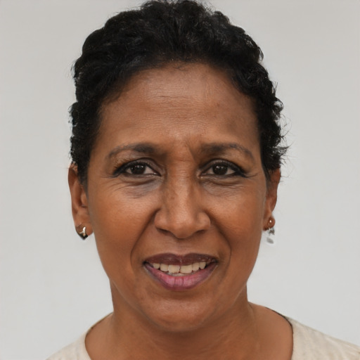 Joyful black adult female with short  black hair and brown eyes