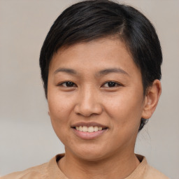 Joyful asian young-adult female with short  brown hair and brown eyes