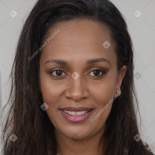 Joyful black young-adult female with long  brown hair and brown eyes