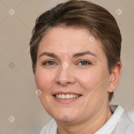 Joyful white adult female with short  brown hair and brown eyes