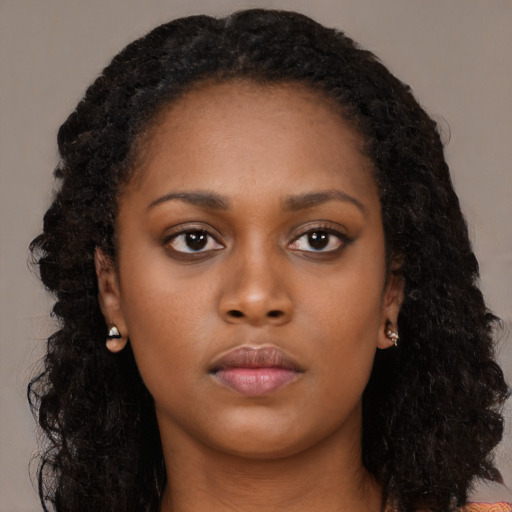Neutral black young-adult female with long  black hair and brown eyes