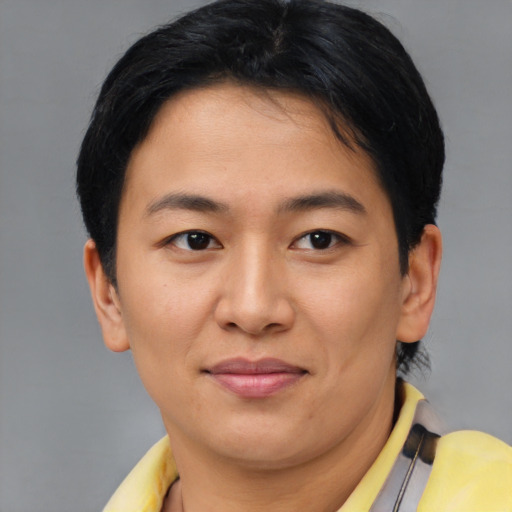 Joyful asian young-adult female with short  brown hair and brown eyes