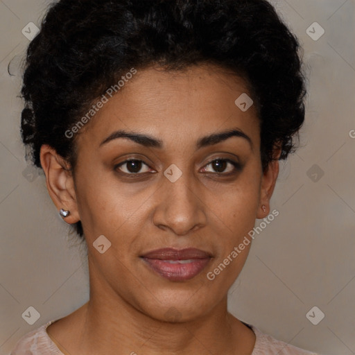 Joyful black young-adult female with short  black hair and brown eyes