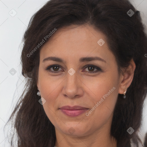 Joyful white adult female with long  brown hair and brown eyes