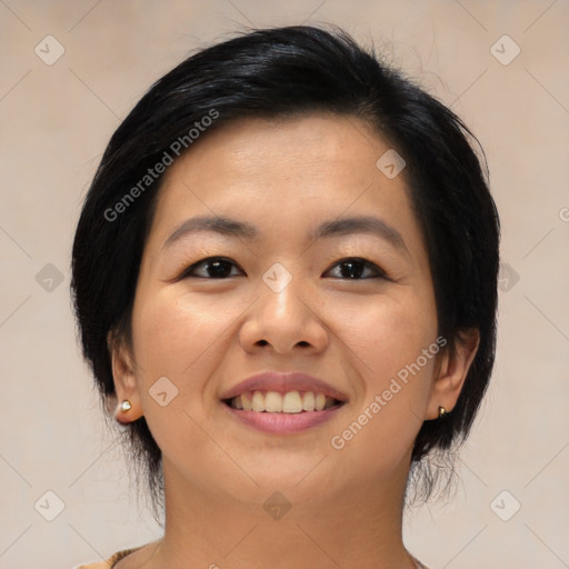 Joyful asian young-adult female with medium  black hair and brown eyes