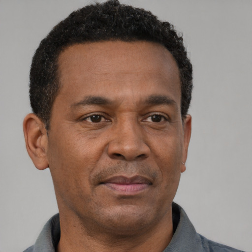 Neutral latino adult male with short  brown hair and brown eyes